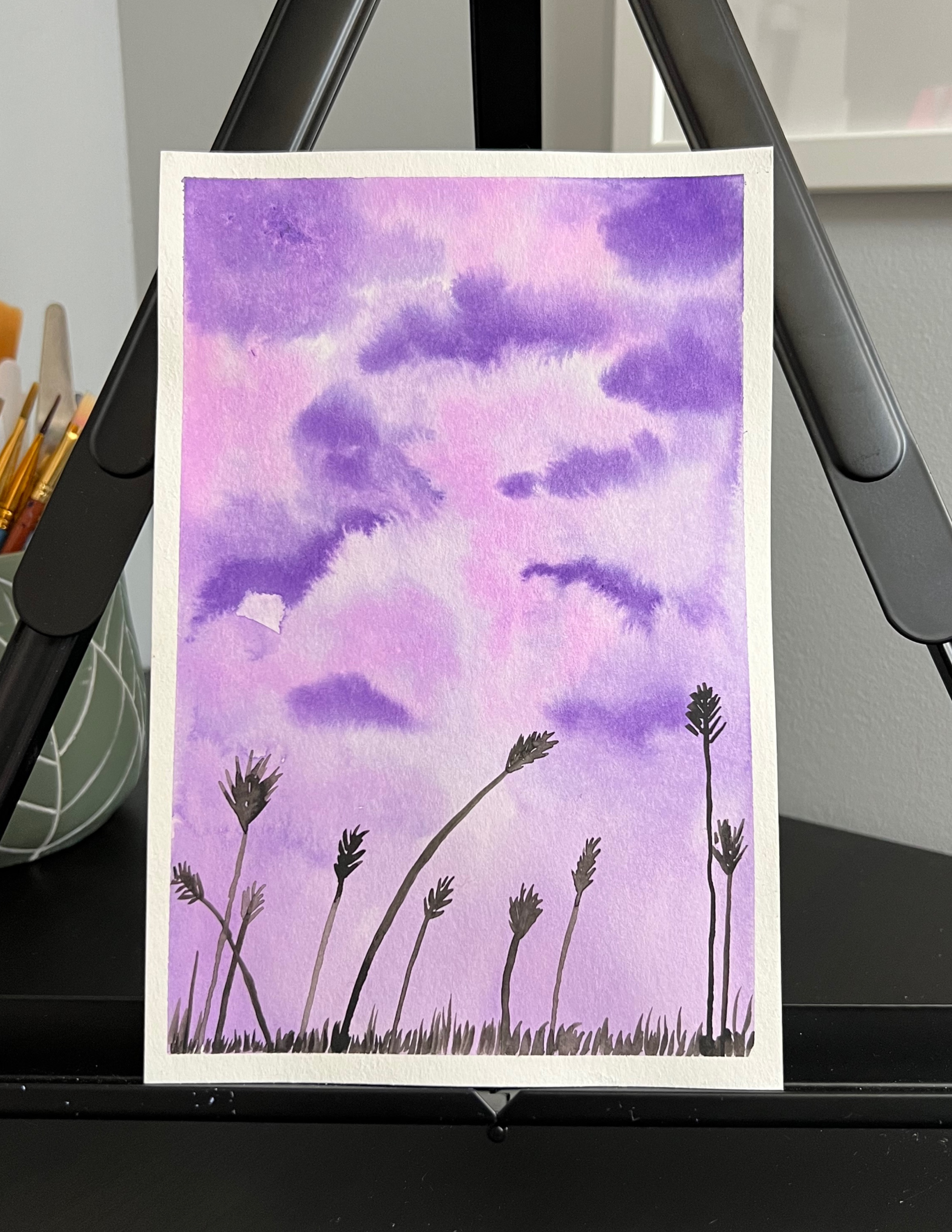 watercolour painting of wheat in front of a purple sky 